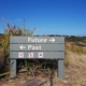 Sign pointing towards the future and the past