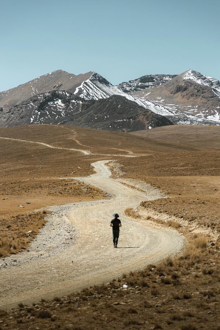 Person walking along a winding path representing a nonlinear career journey